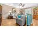 Bright living room featuring neutral walls, elegant furnishings, and a striking ceiling fan at 439 Colonial Trace Dr. # 119, Longs, SC 29568