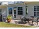 Outdoor patio featuring a dining set and grill, ideal for entertaining and enjoying outdoor meals at 439 Colonial Trace Dr. # 119, Longs, SC 29568