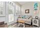 Bright sunroom featuring a comfortable seating area and lots of natural light at 439 Colonial Trace Dr. # 119, Longs, SC 29568