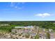 Aerial view of a community highlighting the location of 4413 North Plantation Harbour Drive #A near a lush green forest at 4413 Plantation Harbour Dr. # A, Little River, SC 29566