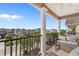 Relaxing balcony view with comfortable seating and elegant columns overlooking the neighborhood at 4413 Plantation Harbour Dr. # A, Little River, SC 29566
