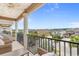 Relaxing balcony view with comfortable seating and elegant columns overlooking the neighborhood at 4413 Plantation Harbour Dr. # A, Little River, SC 29566