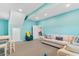 Open basement features a comfortable seating area, with neutral colored couches and blue accent chairs at 4413 Plantation Harbour Dr. # A, Little River, SC 29566