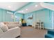Recreational room with light blue painted walls, comfy sofas, and modern amenities create a relaxing living space at 4413 Plantation Harbour Dr. # A, Little River, SC 29566