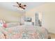 Comfortable bedroom with two beds, ceiling fan, and access to a bathroom at 4413 Plantation Harbour Dr. # A, Little River, SC 29566