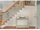 Inviting foyer with elegant staircase featuring decorative iron railings and a wooden handrail at 4413 Plantation Harbour Dr. # A, Little River, SC 29566