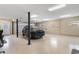 Spacious garage featuring polished concrete floors, overhead lighting, and space for parking vehicles at 4413 Plantation Harbour Dr. # A, Little River, SC 29566
