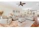 Spacious living room features plush seating, hardwood floors and neutral decor at 4413 Plantation Harbour Dr. # A, Little River, SC 29566