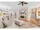Comfortable living room features a modern fireplace, tv, hardwood floors, and neutral decor at 4413 Plantation Harbour Dr. # A, Little River, SC 29566