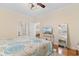 Comfortable bedroom with hardwood floors, ceiling fan, and a soothing color palette at 4413 Plantation Harbour Dr. # A, Little River, SC 29566