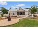 Cozy backyard featuring a fire pit, screened porch, grilling area, and well-maintained landscaping at 4419 Kinlaw St., Little River, SC 29566