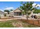 Backyard with a screened porch, patio with grill, landscaped beds, and well maintained lawn at 4419 Kinlaw St., Little River, SC 29566