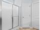 Modern bathroom features a glass shower with white doors and a separate toilet room at 4419 Kinlaw St., Little River, SC 29566