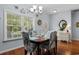 Bright dining room features a wood table with decorative chairs and a window at 4419 Kinlaw St., Little River, SC 29566