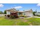 Well-maintained home with lush landscaping, a garage, and a neatly trimmed lawn at 4419 Kinlaw St., Little River, SC 29566