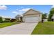 Exterior of a home showing the two car garage with a concrete driveway and well maintained lawn at 4419 Kinlaw St., Little River, SC 29566