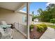 Charming front porch with seating, landscaped garden beds, and a lovely walkway at 4419 Kinlaw St., Little River, SC 29566
