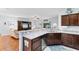 Modern kitchen featuring stainless steel dishwasher, granite countertops, and ample counterspace at 4419 Kinlaw St., Little River, SC 29566