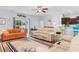 Open-concept living room with hardwood floors and access to the outdoor patio at 4419 Kinlaw St., Little River, SC 29566