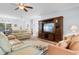 Bright living room with an entertainment center and large sofas for relaxing at 4419 Kinlaw St., Little River, SC 29566