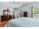 Cozy bedroom features a full bed, hardwood floors, and a window with natural light at 4419 Kinlaw St., Little River, SC 29566