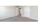 Bedroom featuring neutral walls and carpet, plus two white doors for closet or bathroom access at 442 Acosta Circle, Conway, SC 29527