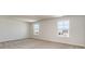 Spacious bedroom with plush carpet and two windows providing natural light at 442 Acosta Circle, Conway, SC 29527