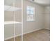 Walk-in closet featuring white shelving and a window for natural light at 442 Acosta Circle, Conway, SC 29527
