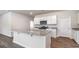 Modern kitchen with stainless steel appliances, granite countertops, a center island, and white cabinets at 442 Acosta Circle, Conway, SC 29527