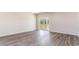 Spacious living room featuring wood-look floors and sliding glass door access to outdoor space at 442 Acosta Circle, Conway, SC 29527