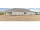 Expansive backyard featuring a covered patio and lush green lawn at 4465 East Coast Ln., Shallotte, NC 28470