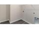 Utility room with washer hookups, shelving, and baseboard trim at 4465 East Coast Ln., Shallotte, NC 28470