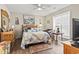 Bright bedroom with large window, ceiling fan, and decorative accents creating a cozy atmosphere at 4497 Little River Inn Ln. # 1502, Little River, SC 29566