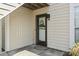 Charming entryway with a decorative wreath, clear address display, and tidy landscaping at 4497 Little River Inn Ln. # 1502, Little River, SC 29566