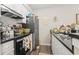 Efficient kitchen featuring modern appliances, sleek black countertops, and ample cabinet space at 4497 Little River Inn Ln. # 1502, Little River, SC 29566