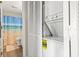 Conveniently located laundry area featuring a stacked washer and dryer, plus access to the bathroom at 4497 Little River Inn Ln. # 1502, Little River, SC 29566