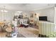 Open-concept living area with a cozy reading chair and adjacent kitchen at 4497 Little River Inn Ln. # 1502, Little River, SC 29566