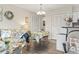 Cozy living room with floral sofa, small dining table, and plenty of closet space at 4497 Little River Inn Ln. # 1502, Little River, SC 29566