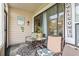 Cozy patio with comfortable seating, decorative rug, and sliding glass door access to the indoors at 4497 Little River Inn Ln. # 1502, Little River, SC 29566