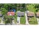 Aerial view of a well-maintained home with mature trees, a spacious backyard, and a long driveway in a quiet neighborhood at 450 Player St., Georgetown, SC 29440