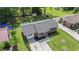 Charming home showcasing a neatly landscaped front yard, new roof, and spacious backyard with mature trees in quiet neighborhood at 450 Player St., Georgetown, SC 29440