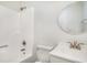 Bright bathroom showcasing a shower-tub combination with an updated vanity and fixtures at 450 Player St., Georgetown, SC 29440