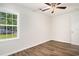 Bedroom featuring stylish wood-look flooring and a window view of outdoor scenery at 450 Player St., Georgetown, SC 29440