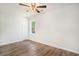Bedroom featuring stylish wood-look flooring, a window view, and a ceiling fan fixture at 450 Player St., Georgetown, SC 29440