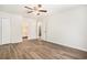 Large bedroom features hardwood floors, ceiling fan, closet, and ensuite bathroom at 450 Player St., Georgetown, SC 29440