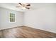 Bedroom with hardwood floors, ceiling fan, and a window letting in plenty of light at 450 Player St., Georgetown, SC 29440