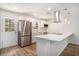 Modern kitchen featuring stainless steel appliances, white countertops, and ample cabinet space at 450 Player St., Georgetown, SC 29440