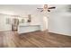 Open-concept kitchen with white cabinetry, stainless steel appliances, and a breakfast bar at 450 Player St., Georgetown, SC 29440