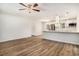 Open-concept kitchen with white cabinetry, stainless steel appliances, and a breakfast bar at 450 Player St., Georgetown, SC 29440