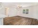 Bright living room with hardwood floors, a ceiling fan, and a view of the front yard at 450 Player St., Georgetown, SC 29440